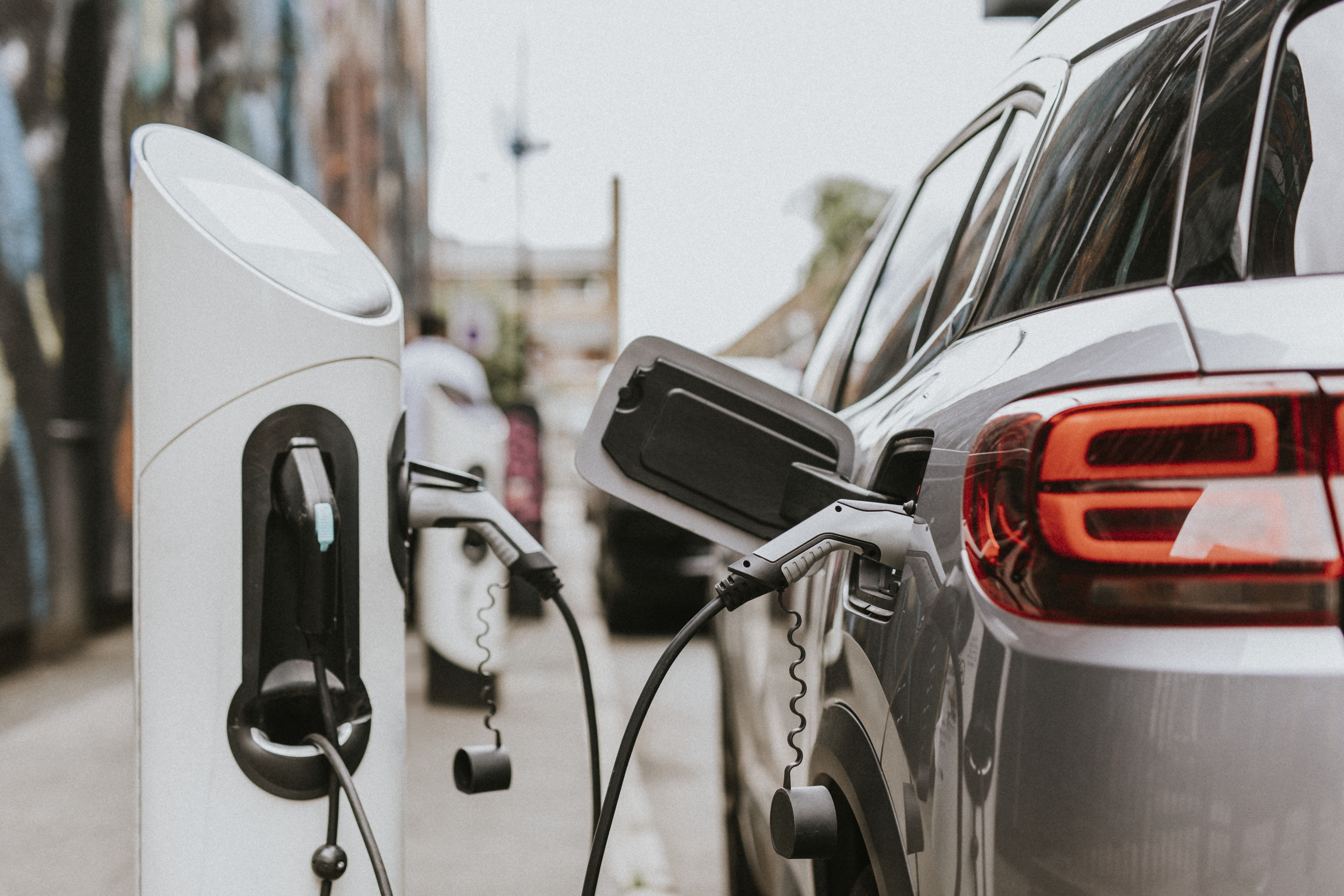 emobility car in front of a refueling station emobility car in front of a refueling station