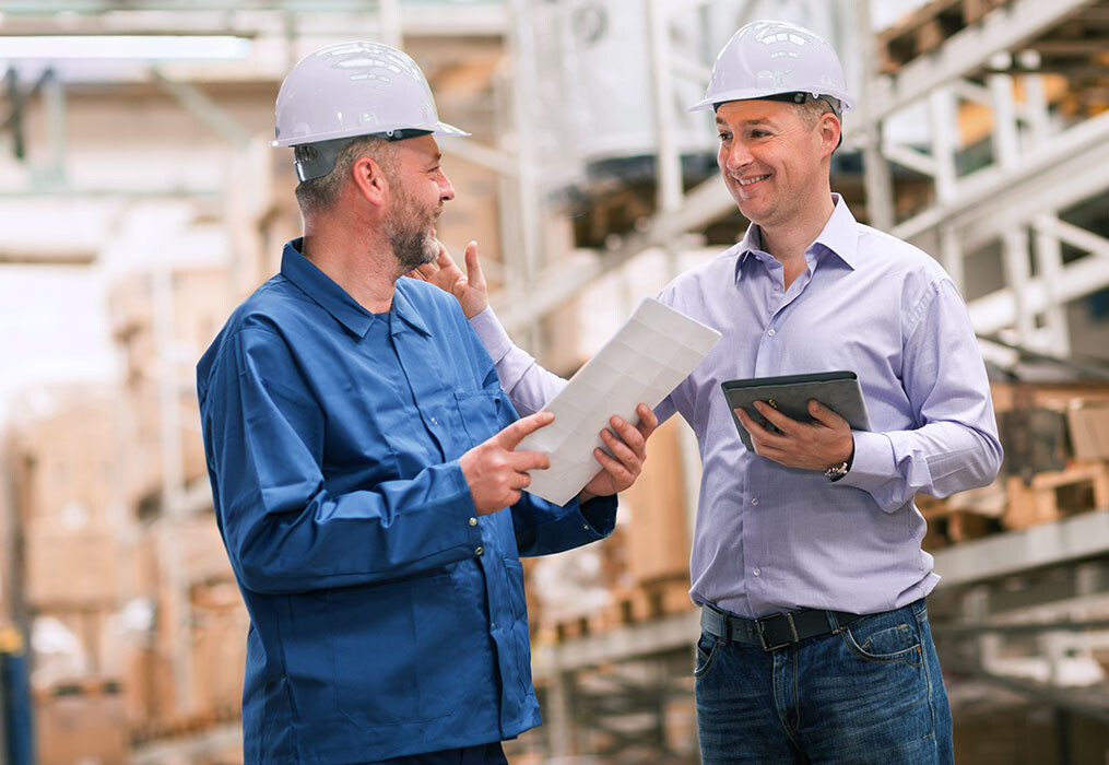 Quote from a Field Superviso Two men standing in a warehouse